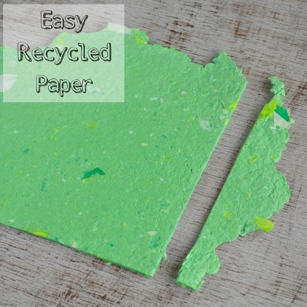 text "easy homemade recycled paper" over the top of a piece of homemade green paper