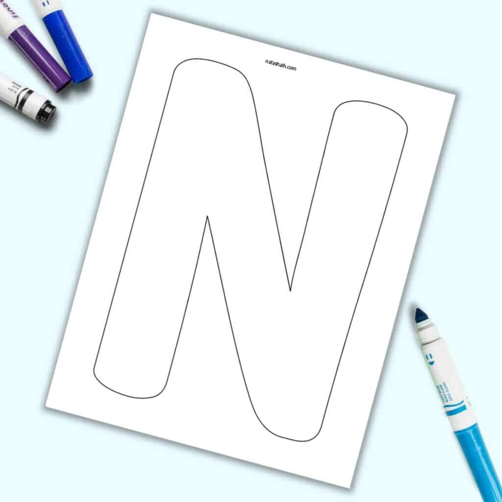 A large bubble letter N with a black outline on a page.