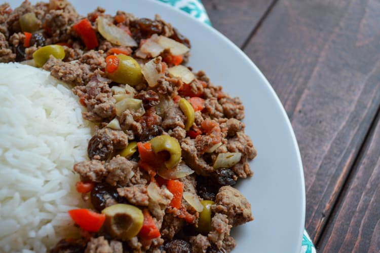 venison picadillo with rice on a white plate