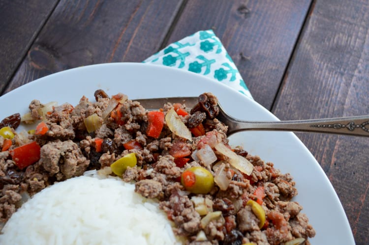 Cuban Picadillo Recipe with Venison on a white plate with a large fork