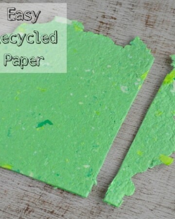 text "easy homemade recycled paper" over the top of a piece of homemade green paper