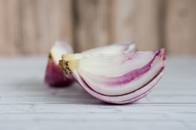 peeled and quartered red onion