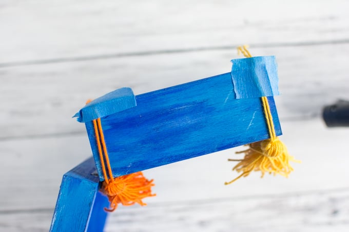 holding tassels in place with painter's tape
