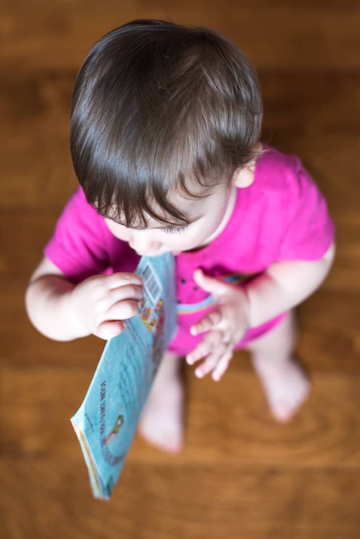 Baby chewing on an Indestructibles Book