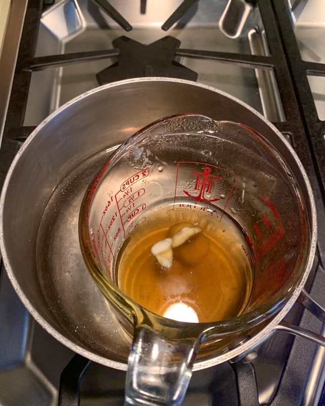 double boiler melting wax for beeswax wraps
