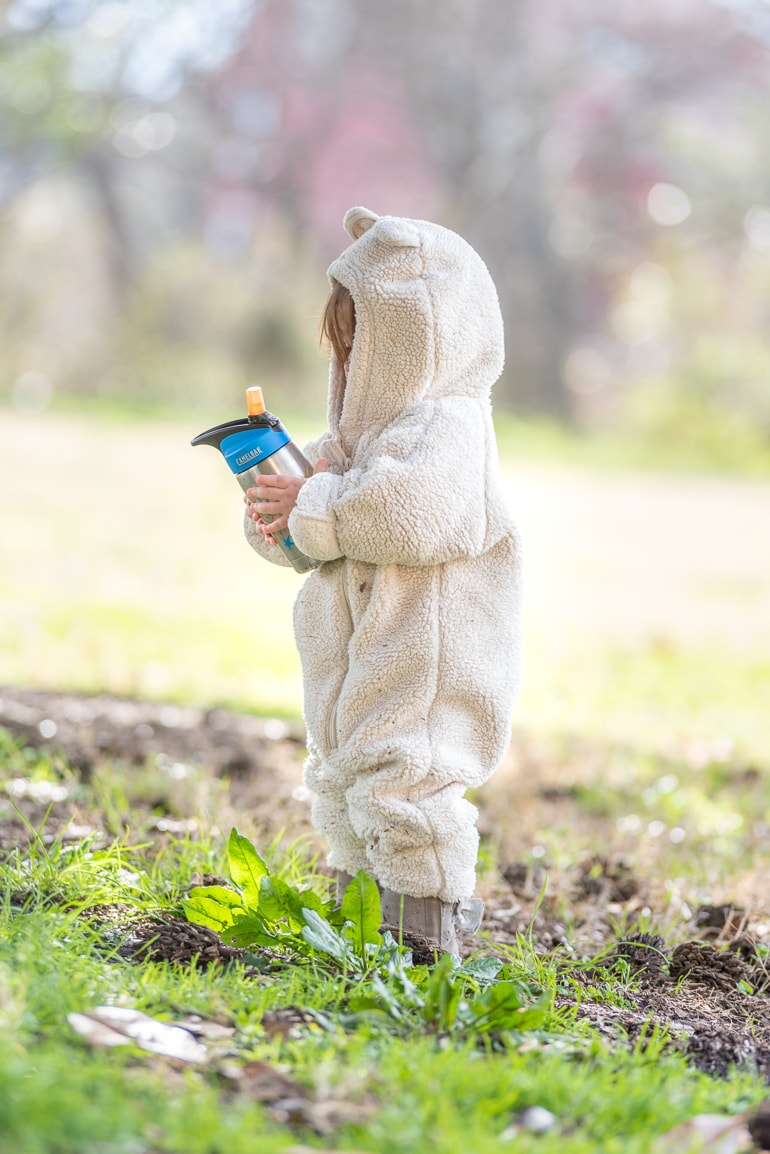 Toddler with a stainless steel water bottle