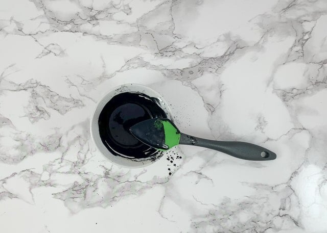 stir activated charcoal into face mask to combine
