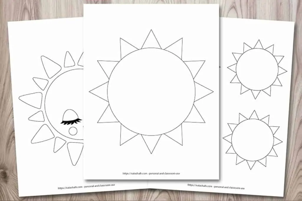 A rectangular image showing a mockup of three printable sun templates on a wood background. The front and center printable has a large simple sun outline that fills the entire page. Behind this sun and to the left is a partially obscured cute sun. It has closed eyes, long eyelashes, and a smile. On the right is a page with three medium sun templates. These suns are 3.75" across when printed and there are four on one page. Half of the page is concealed behind the center sun.