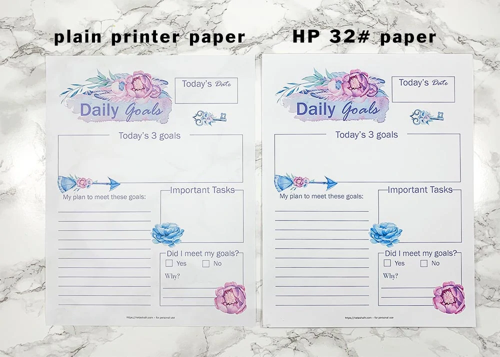 A picture of a daily goals planner page printable with purple and blue florals printed on two different papers. On the left is the page on plain printer paper. On the right is the same page on 32# HP premium paper. There is a label above each page telling what type of paper it is.