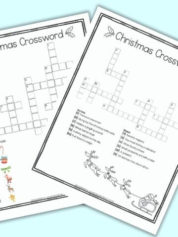 A free printable Christmas crossword puzzle for children featuring image clues instead of text clues. The page has a doodle frame border. The crossword is on a blue background surrounded by children's markers. Behind the page with a crossword puzzle a second page is barely visible. It is the puzzle's answer key.