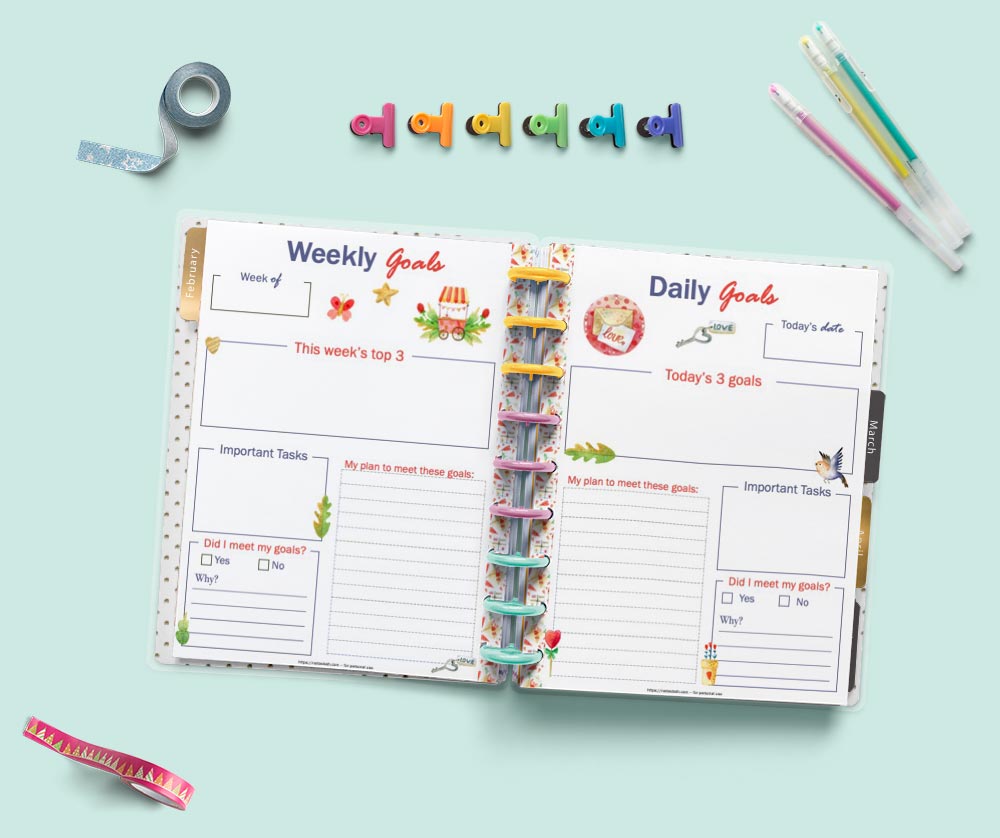 An open Happy Planner Classic showing weekly goals and daily goals planner pages with a Valentine's Day theme