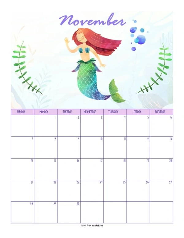 A printable November 2021 calendar with a mermaid theme. The page says "November" at the top in purple script. Below is a waving red haired mermaid with a green tail. She is between two green pieces of sea grass. Below is a dated November 2021 calendar. 