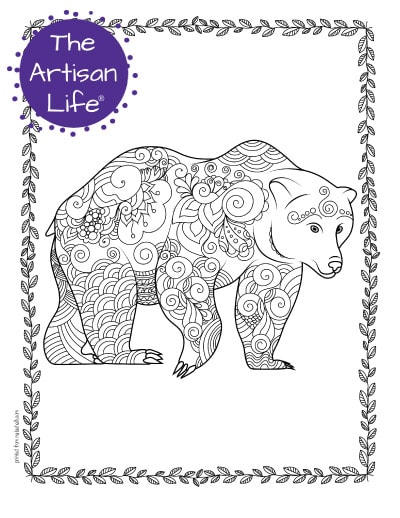 A preview of a bear coloring page for adults. The large bear has hand drawn doodles to color and the page is bordered by a doodle frame. A purple round logo reading "the artisan life®" is in the corner.