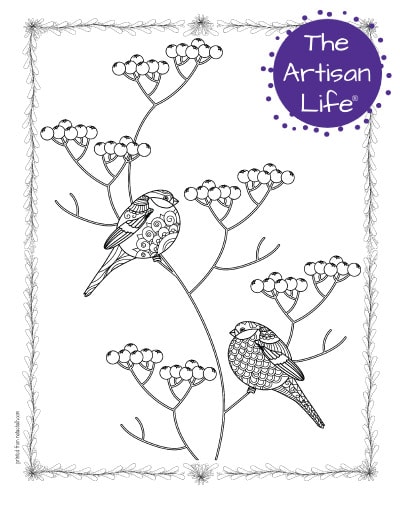 A preview of a coloring page for adults. The page has two bullfinch birds sitting on a holly branch. The birds have hand drawn doodles to color and the page is bordered by a doodle frame. A purple round logo reading "the artisan life®" is in the corner.