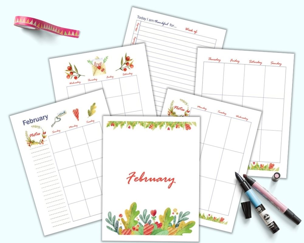 A flatlay mockup of 6 pages of free printable February planner pages including a cover page, monthly two page spread, vertical weekly two page spread, and gratitude journal page