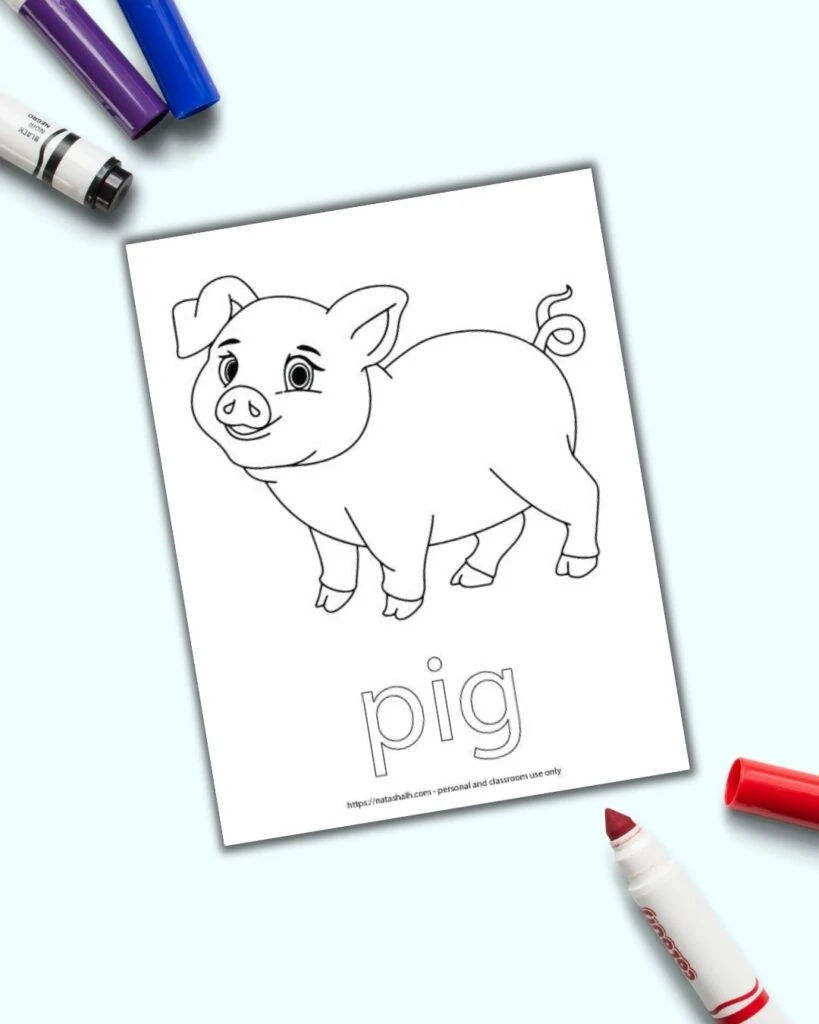 A free printable pig coloring page with "pig" in bubble letters to color. The page is next to an open red child's marker on a blue surface.