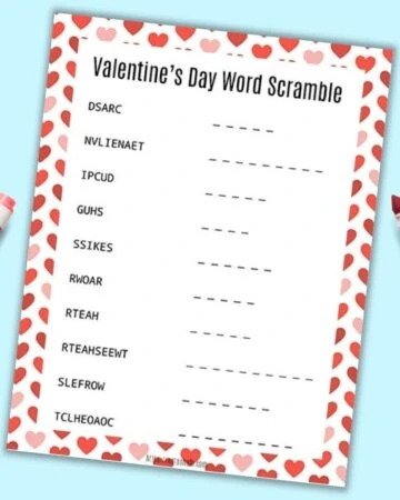 a free printable Valentine's Day word scramble with a red and pink heart border on a blue background.