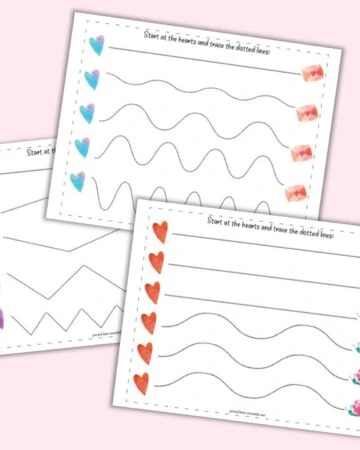 A flatlay mockup with three printable Valentine's Day tracing worksheets. Each page has a row of five hearts on the left followed by five dotted hearts to trace. Pages include straight, wavy, and zig-zag lines