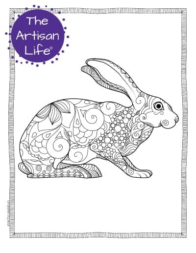 A preview of a hare coloring page for adults. The hare is shown from the side and has hand drawn doodles to color and the page is bordered by a doodle frame. A purple round logo reading "the artisan life®" is in the corner.