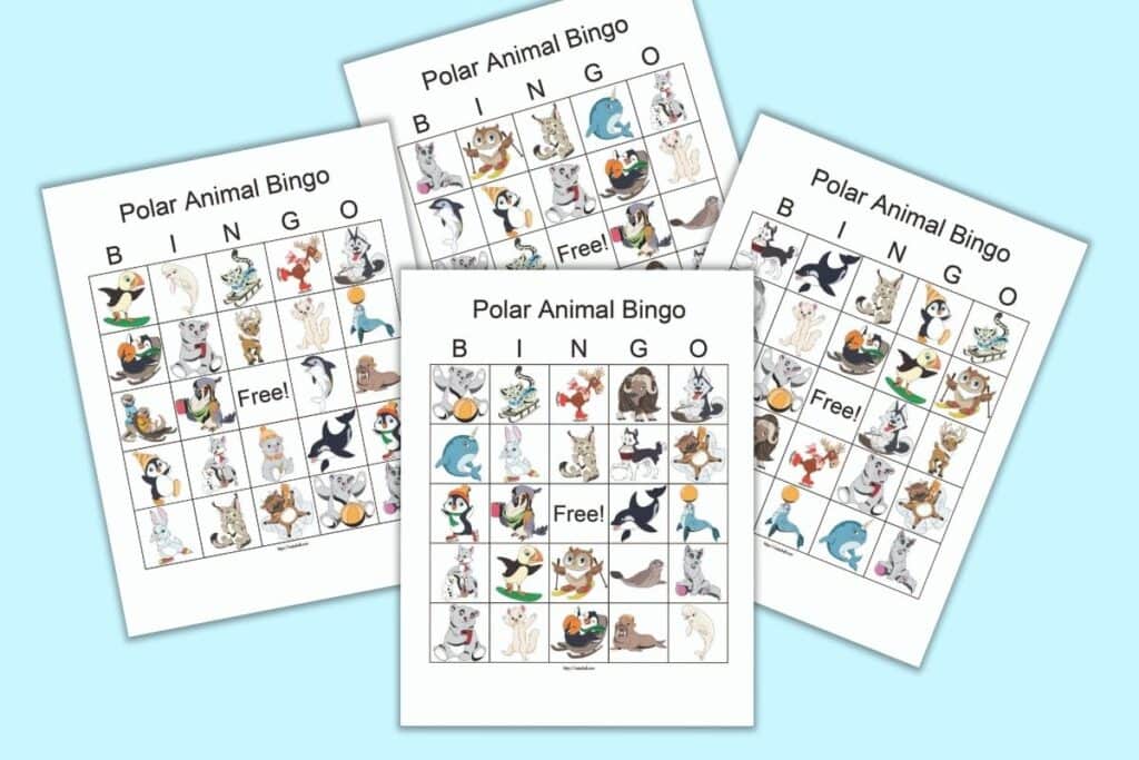 Four free printable polar animal bingo cards on a blue background. Each card has 24 cartoon polar animals and a central free space. 