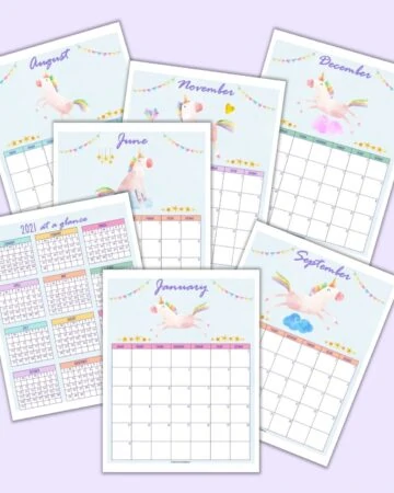 a flatlay mockup of 7 printable unicorn calendar pages for 2021 including a year at a glance page and monthly pages