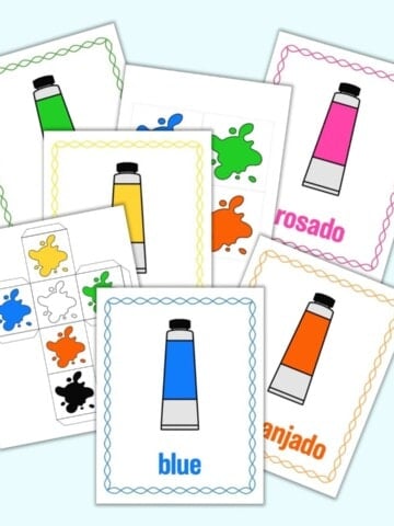 a mockup flatlay preview of a printable color matching game. The image has five color posters and two printable dice templates. Each color poster has a cartoon tube of paint, the color's name, and a matching color border.