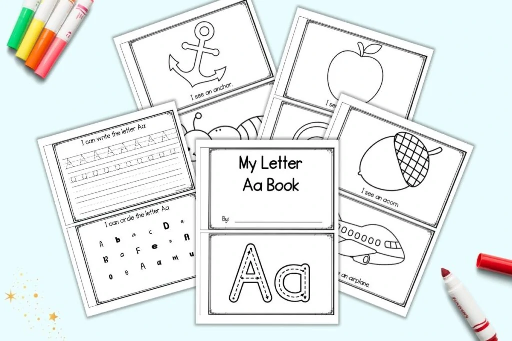 A flatlay of five sheets of printable letter a emergent reader. Each sheet has two pages to cut apart and staple. Pages include "I see an..." acorn, airplane, able, avocado, anchor, and ant as well as tracing pages. The pages are on a blue background with colorful children's markers. 