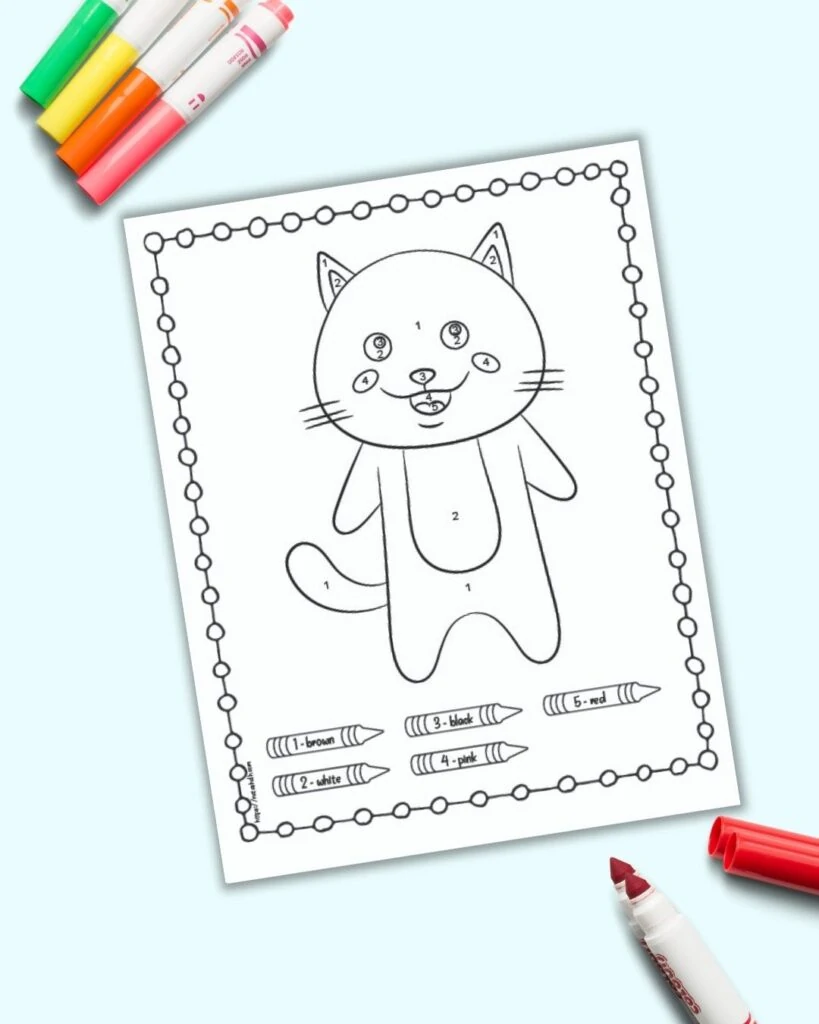 An easy cat color by number page for children with numbers 1-5 to color. The page is shown on a blue background with colorful children's markers. 