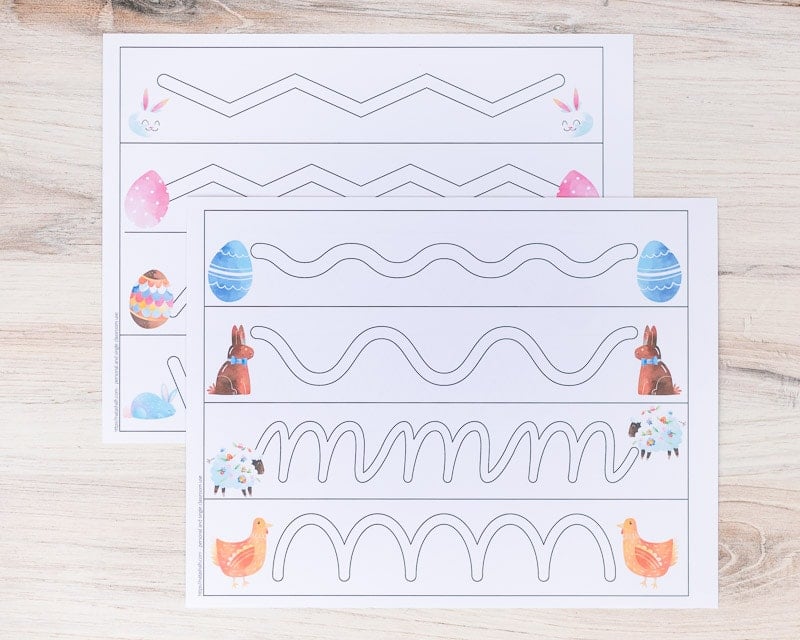 Two pages of printed trace in the path strips for preschoolers. Each page has four paths to trace with Easter clipart on each end.