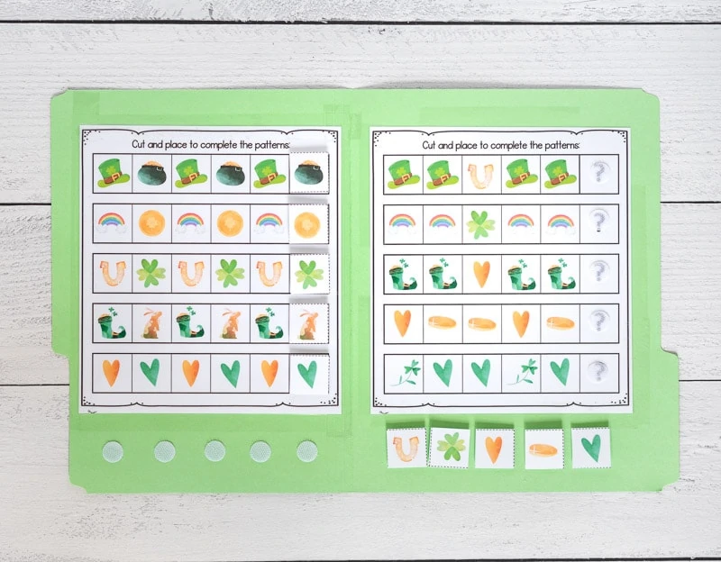 Two pages of printed complete the sequence printables for preschoolers. The pages are taped inside a green file folder and have hook and loop dots to hold tiles a child can use to complete each pattern.