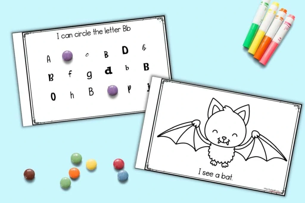 Two pages from a printable letter b book for early education. One page has a cute bat and the text "I see a bat." The other page reads "I can circle the letter Bb" and has letters in various fonts. A round purple candy covers two of the letters. The pages area on a light blue background with colorful children's markers and candies.