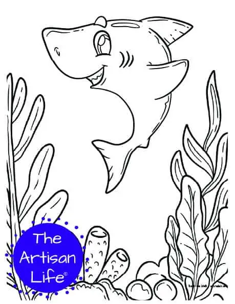 A children's coloring page with a cute shark on a background with coral and seaweed to color. 
