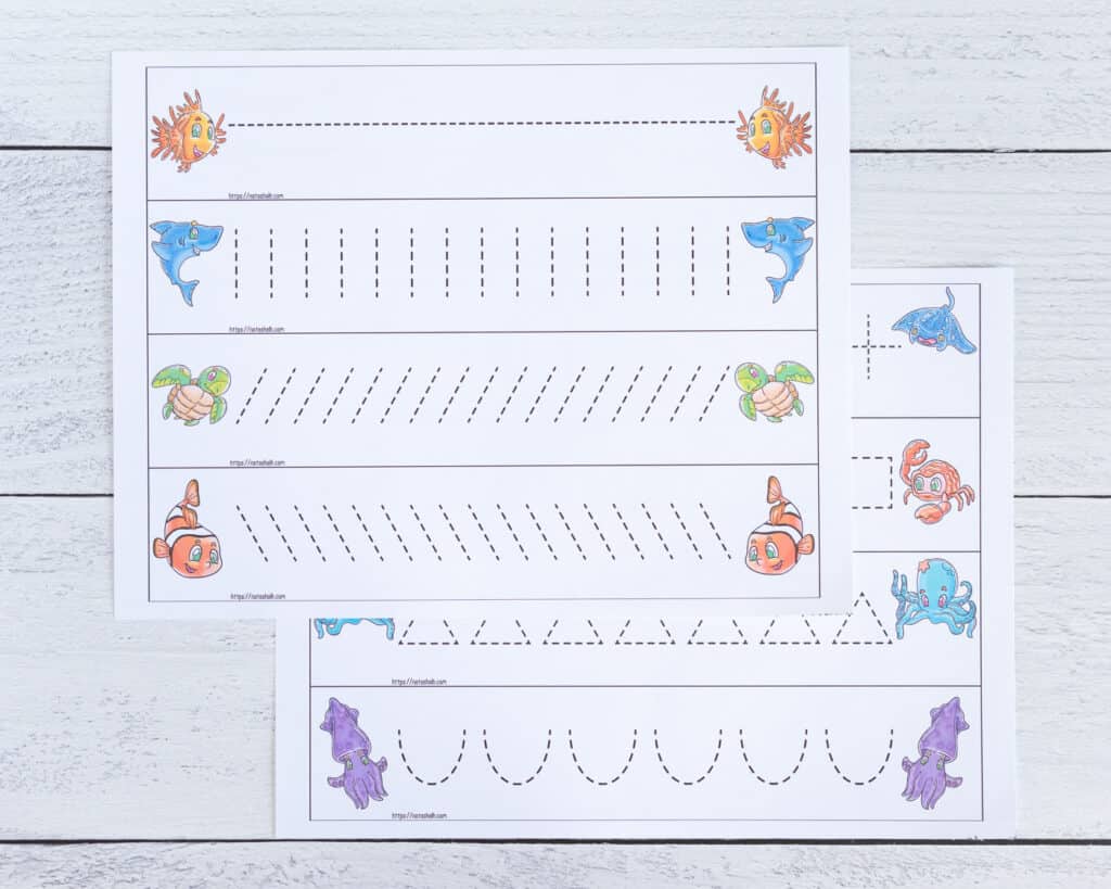 Two pages of printable prewriting practice cards with an ocean theme. Each page has four cards to cut out with dotted lines to trace.