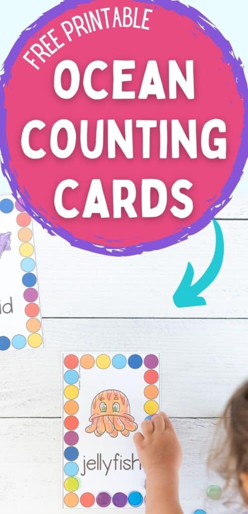 Text "free printable ocean counting cards" above A top down view of a preschooler using plastic chips to cover colorful circles on a counting mat. The mat has an orange jellyfish in the center surrounded by a rectangle made of large colorful circles to count and cover.