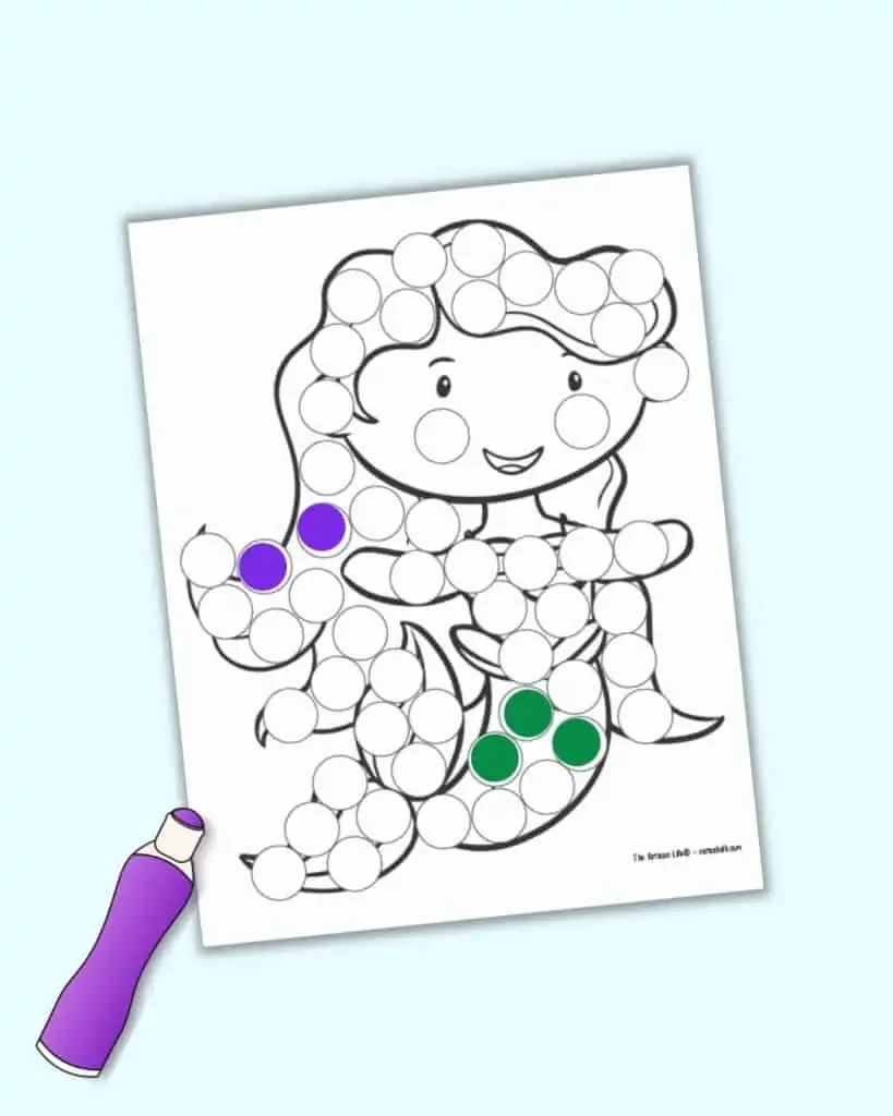 A preview of a mermaid dot marker printable with three green dots on her tail and two purple dots on her hair.