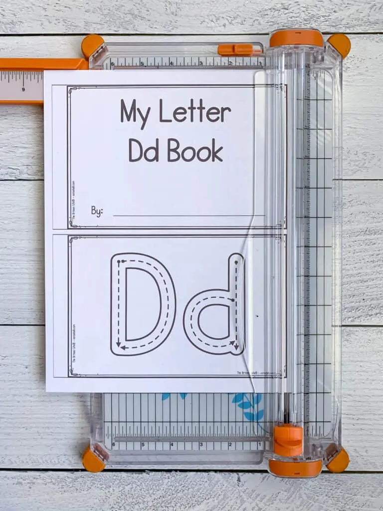 The cover page from a printable preschool book called "My letter Dd book" on an orange paper trimmer.