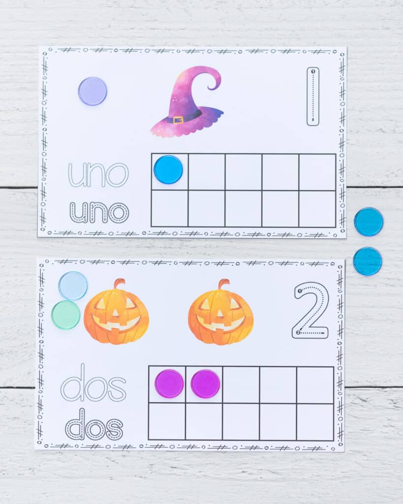 Two printable Halloween ten frame printables with one and two in Spanish.