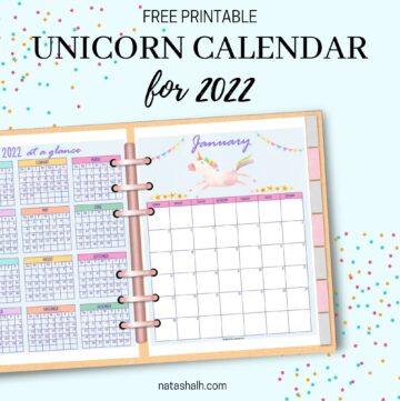 A mockup preview of a 2022 calendar printable with unicorns in a six ring planner. A 2022 year at a glance page is on the left, a January 2022 calendar is on the right.