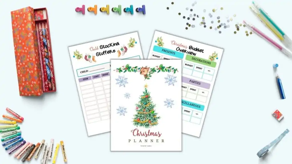 A preview of three printable Christmas planner pages (a cover page, budget overview, and child stocking stuffer planner" with assorted stationary supplies including gel pens, binder clips, and pencils.