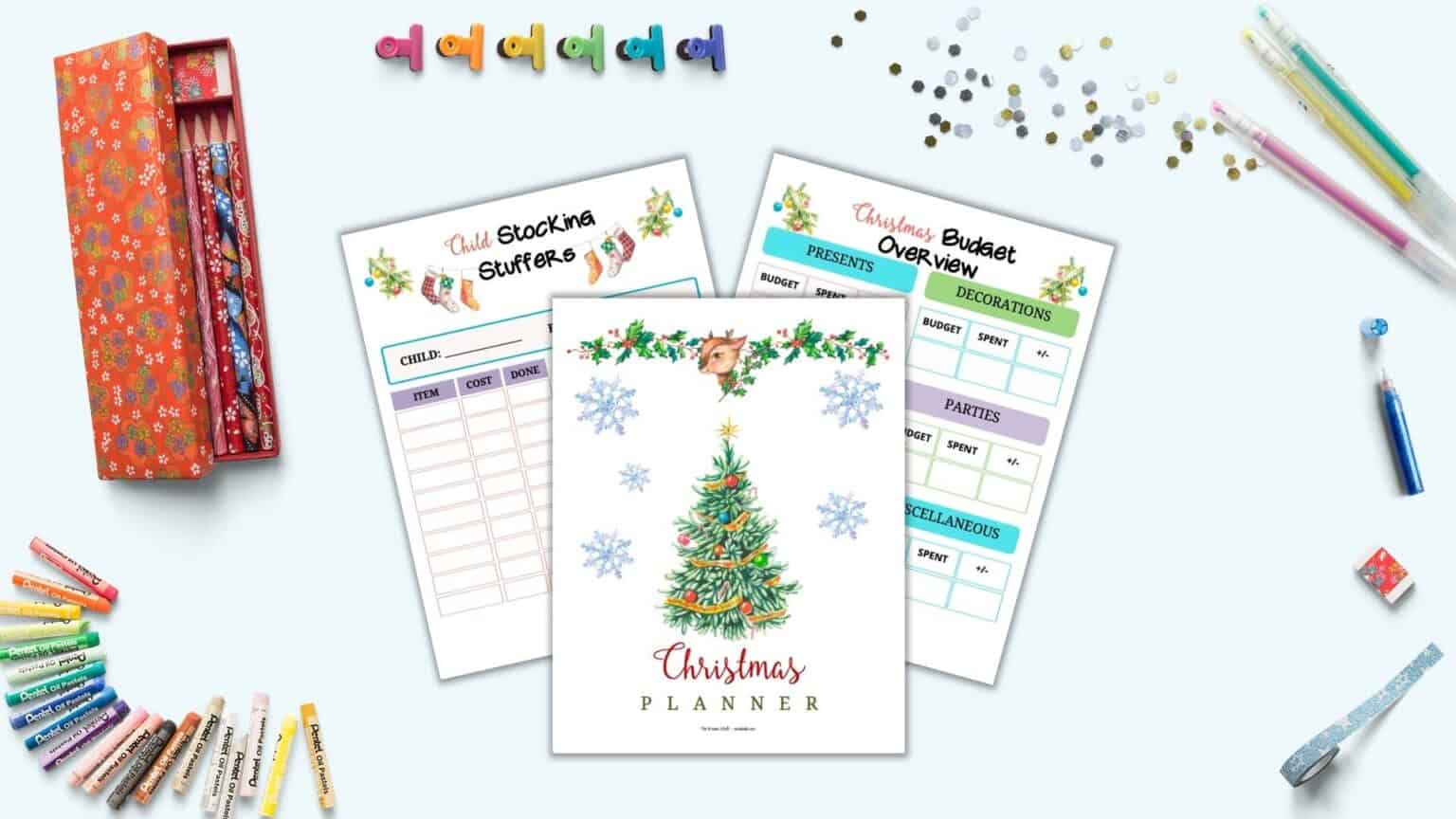 A preview of three printable Christmas planner pages (a cover page, budget overview, and child stocking stuffer planner" with assorted stationary supplies including gel pens, binder clips, and pencils.