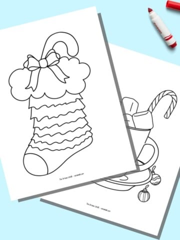 A preview of two printable easy Christmas pages. The page on front has a stocking with a candy cane. The page in back has a cup of hot chocolate.