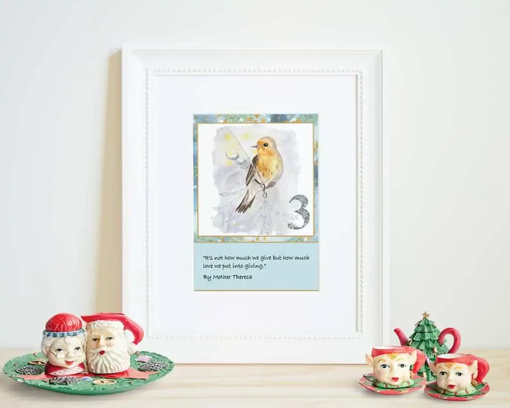 A 5x7 printable watercolor Advent card for December 3 with a quotation from Mother Theresa. The cards is in a white frame on a shelf with a Santa teaser. 