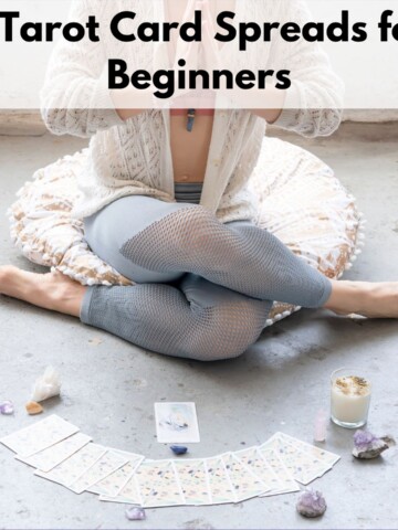 Text "5 tarot card spreads for beginners" over an image of a woman sitting in shoelace post with a spread of cards