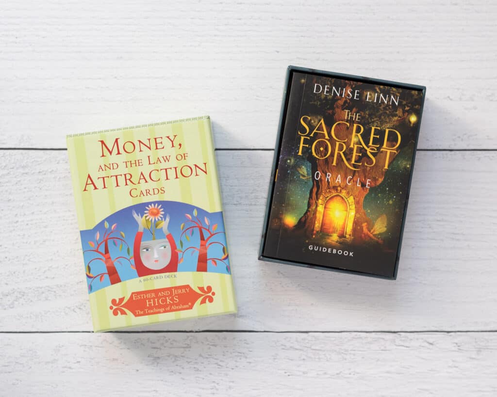Two oracle card decks - Money and the Law of Attraction and The Sacred Forest.