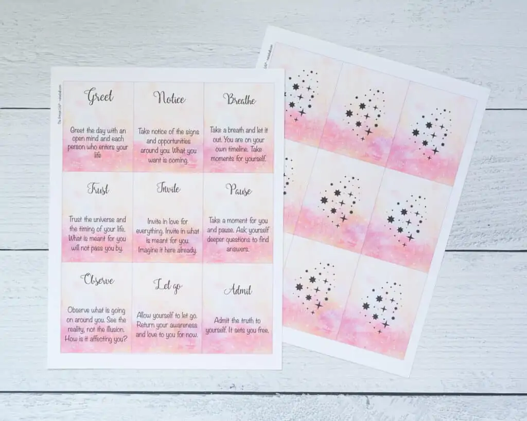 A preview of two printed pages of word of the day oracle cards with a pink watercolor background 