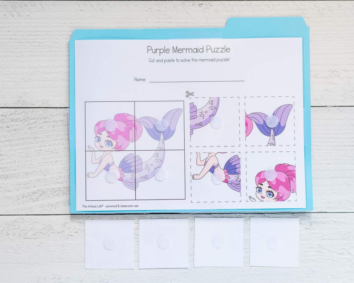A file folder game of a four piece puzzle with a mermaid