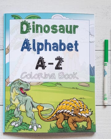 A preview of a Dinosaur Alphabet A-Z coloring book. It is on a white wood background with three children's markers