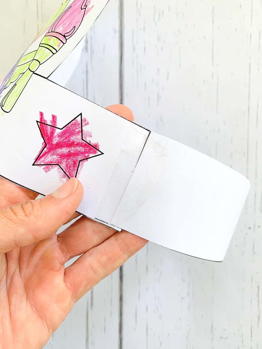Taping a printable headband craft together to make the band
