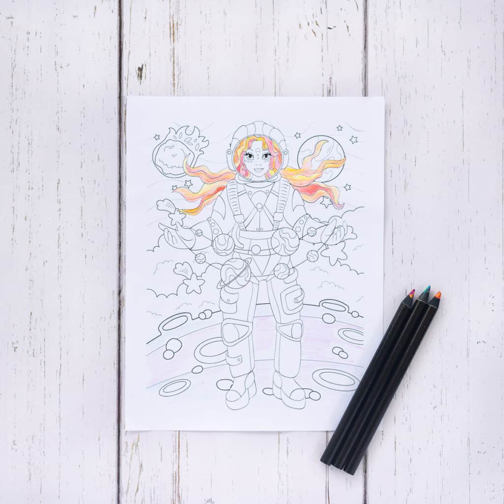A coloring page with a girl with flowing red hair standing on the moon holding a garland of planets