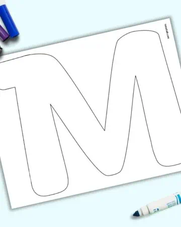 A page with a large bubble letter M. It is shown on a light blue background with colorful children's markers.